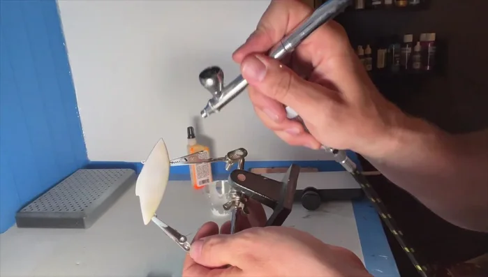 Apply a finishing coat and add details (eyes, etc.).