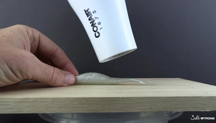 Observe until the plastic becomes malleable (about 1.5 minutes for a thin section).