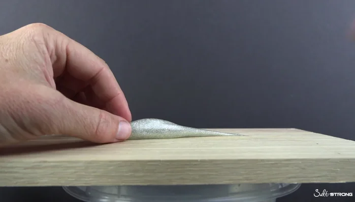 Prop the lure up with other lures to prevent it from moving while cooling.