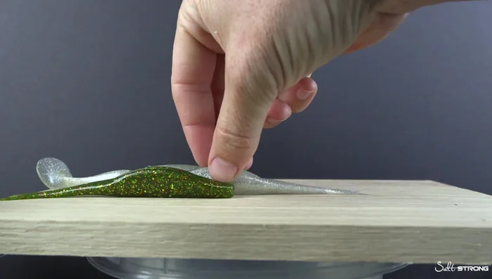 Allow the lure to cool completely and solidify in its new shape.