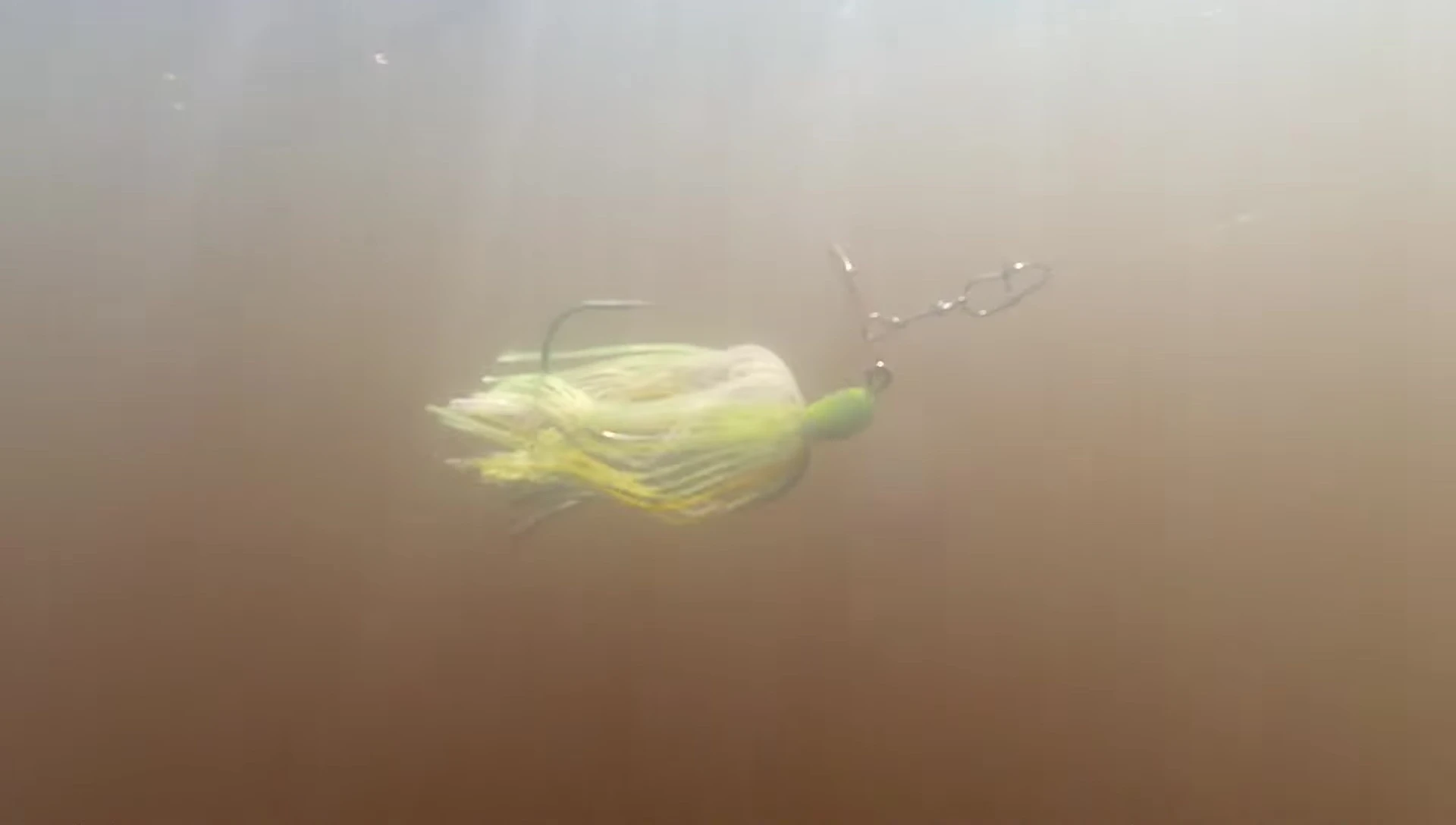 Angler fishing in stained water.