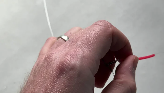 Tease the tubing down to the swivel.