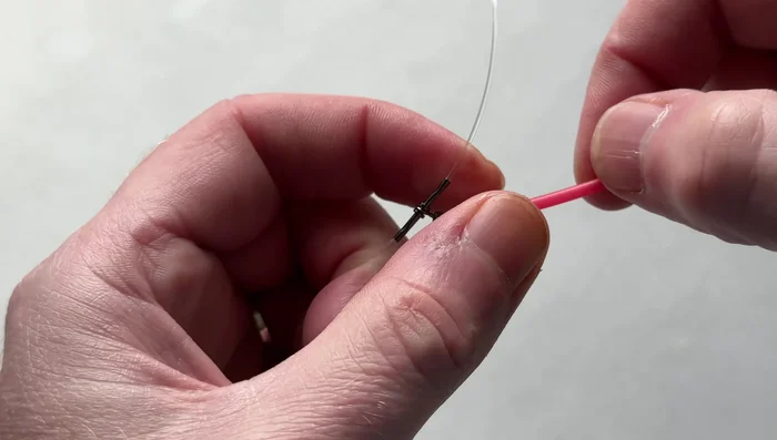 Tease the tubing down to the swivel.