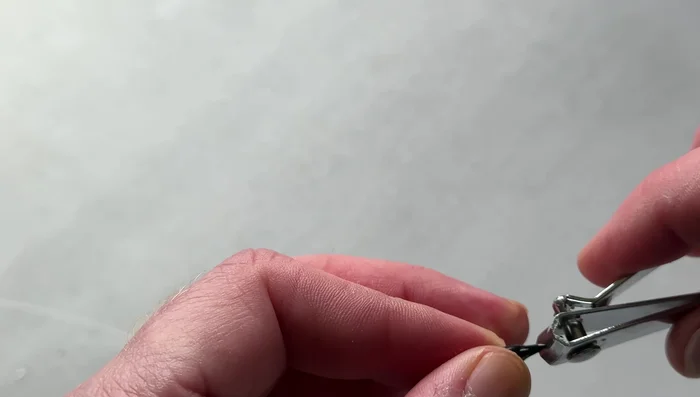 Use a breakaway knot protector to cover the tag end of the knot and link clip, preventing snags.