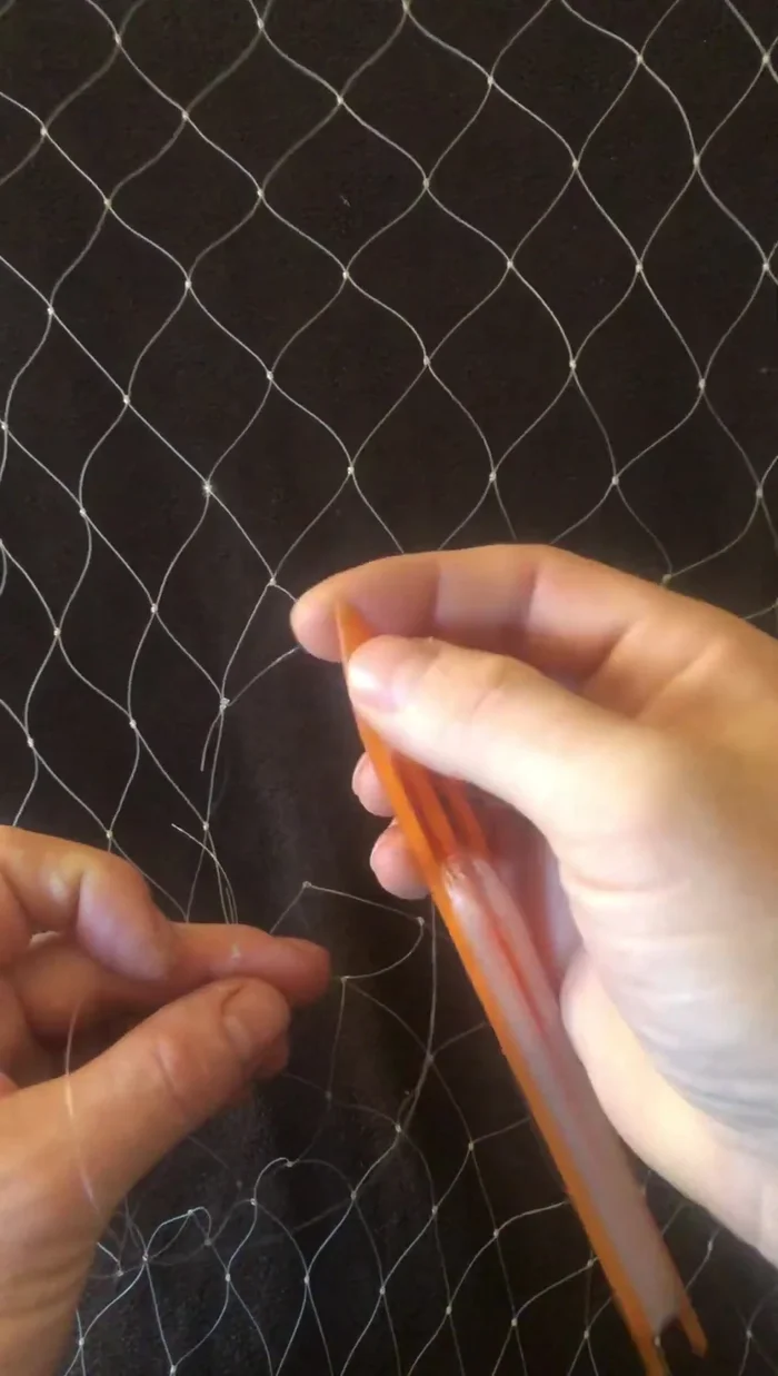 Repeat steps 3-6 for each damaged mesh, working your way through the damaged area of the net.