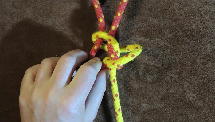 Pull it through to tighten.