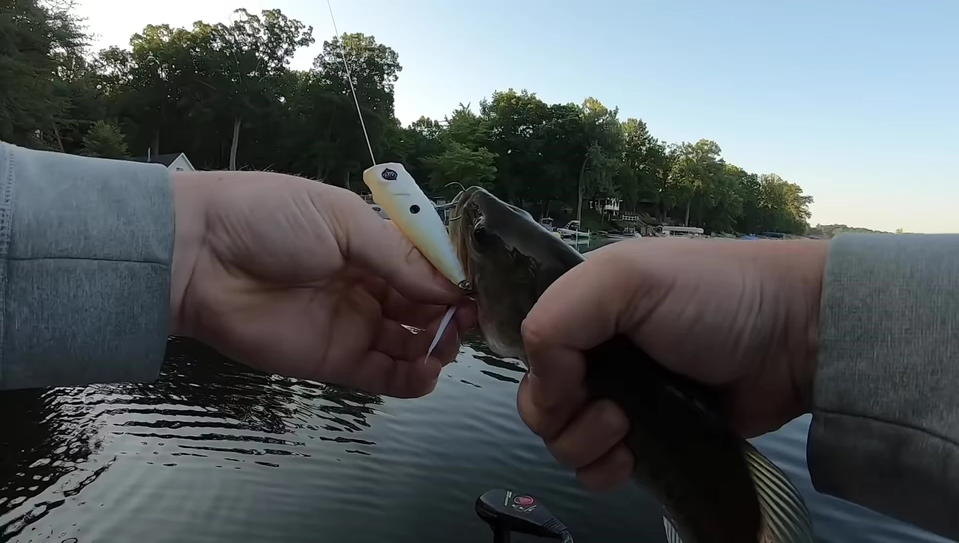 The angler holds up the Googan Squad Blooper after catching a fish