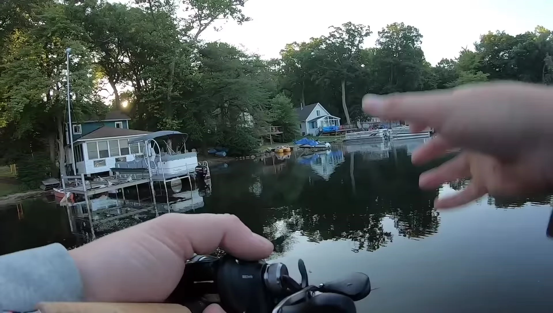 Angler demonstrating the slow and steady retrieve near a dock.
