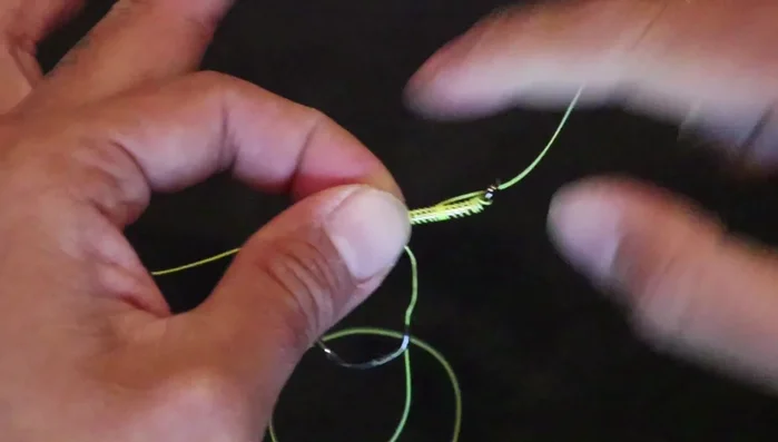 Tighten the knot slowly and carefully, ensuring everything stays tight. 