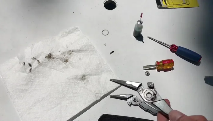 Clean the moving mechanism thoroughly using a Q-tip.