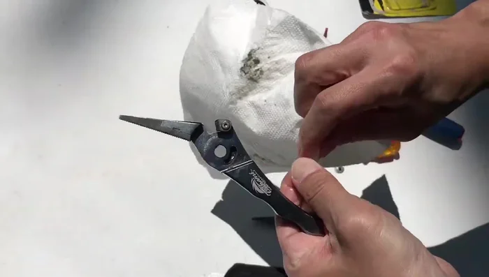 Clean the moving mechanism thoroughly using a Q-tip.