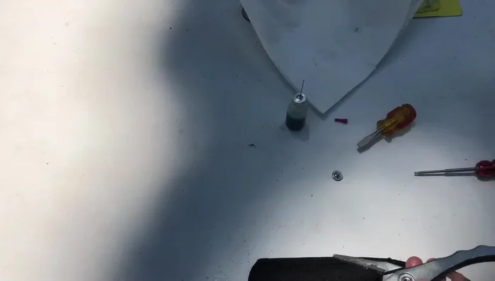 Tighten the set screw, leaving it slightly loose initially to allow for spring action.