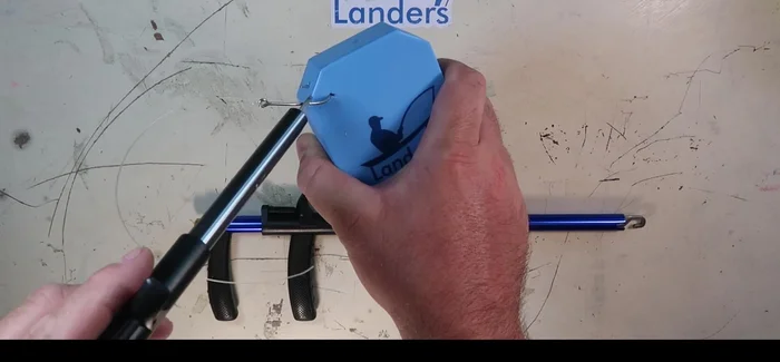 Close the tool firmly on the hook.