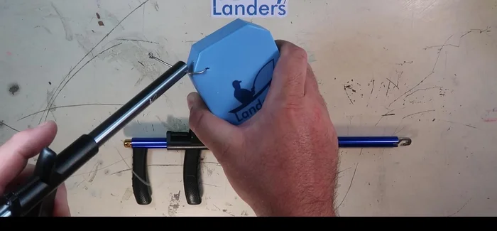 Lift the hook out of the fish's mouth.