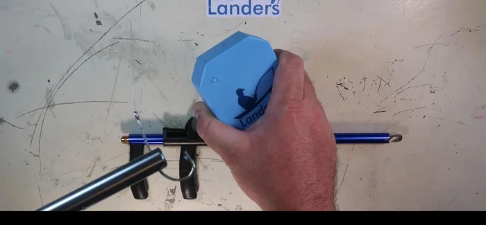 Open the tool to release the hook.