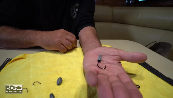 Use a bullet weight to make the hook almost invisible. Place the bullet so the eye of the hook goes up inside the bullet weight.