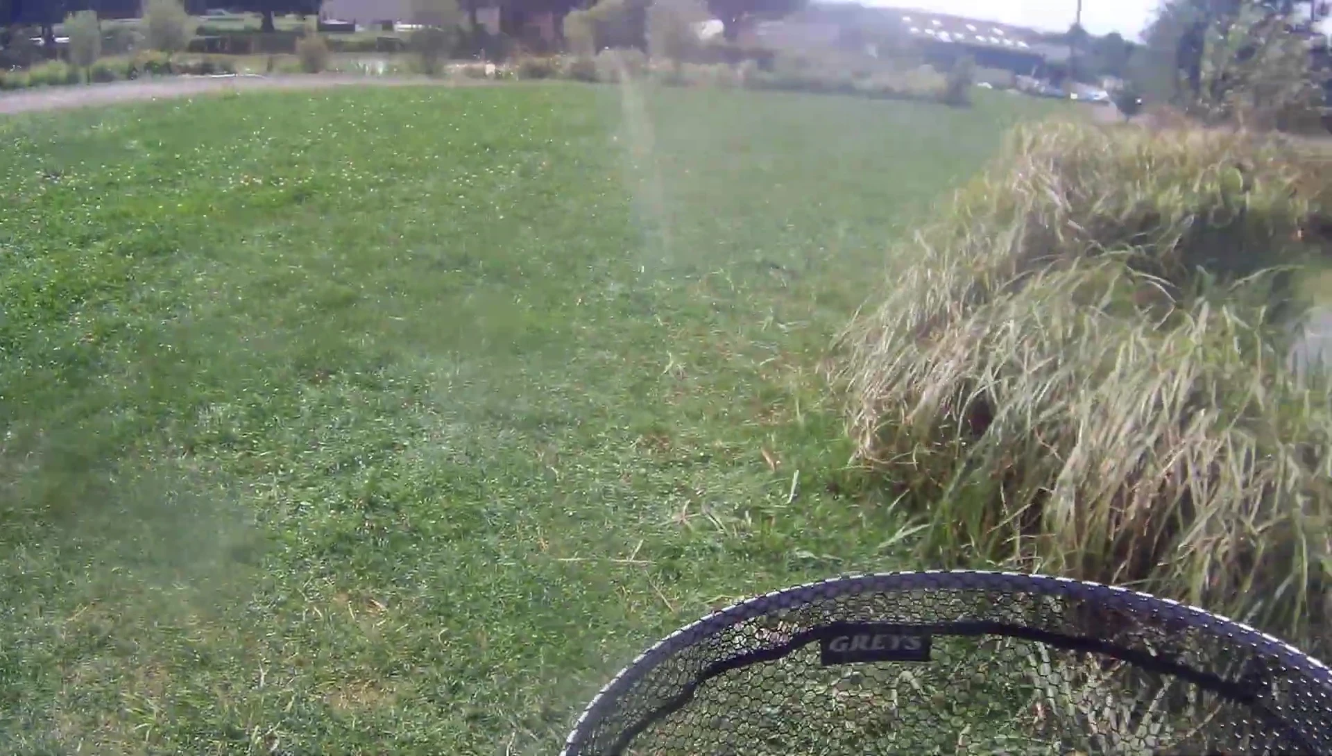 The Greys GX landing net attached to a belt