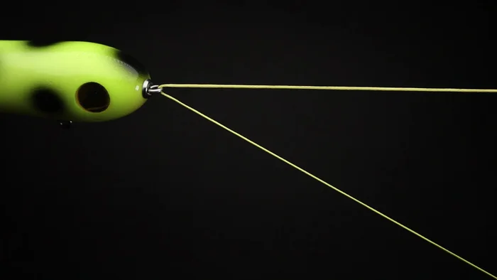 Create a loop by laying the end of the line over the main line and pinch all three lines together.