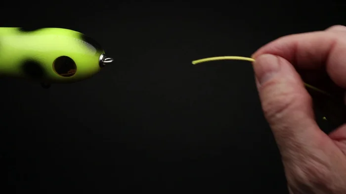 Pull through about eight to ten inches of line.