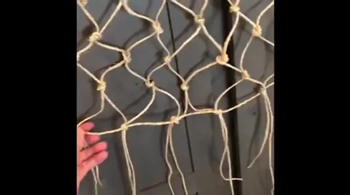 Trim the excess string from the completed net.