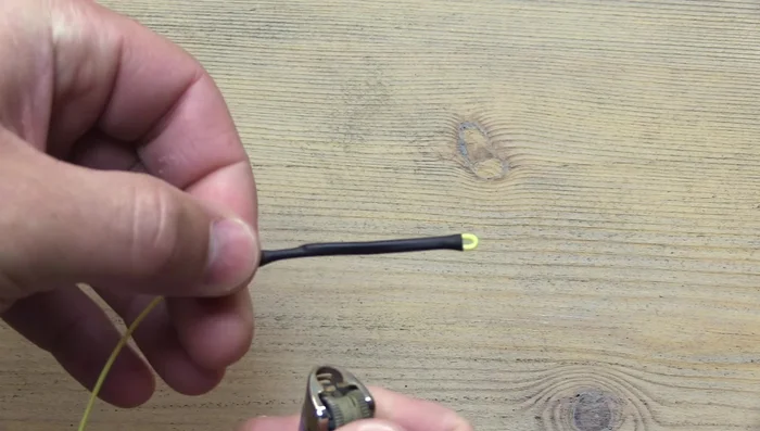 Gently heat the loop itself with the side of the flame, avoiding direct heat, until it slightly wilts. Do not overheat.