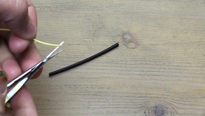 Fold over about an inch of the fly line.