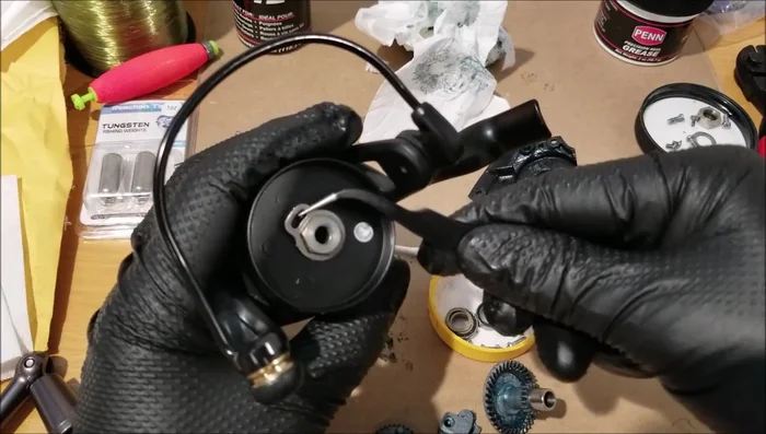 Remove the rotor (remove small screw first), then remove the inner components using an 11mm socket. Inspect for sand.