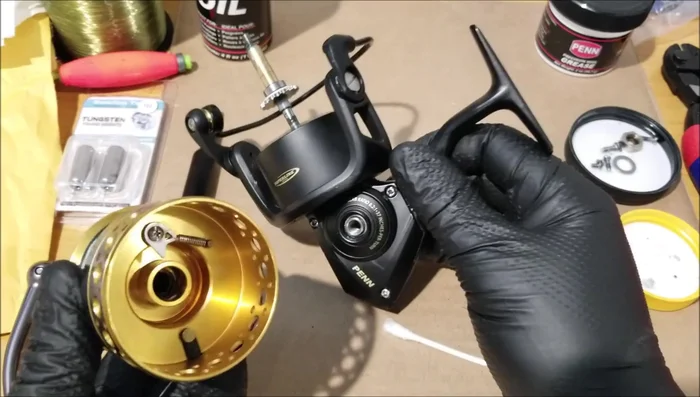 Remove the spool. Inspect the inside for sand; remove with a Q-tip if necessary.