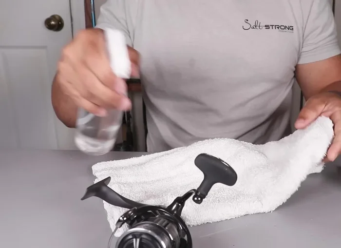 Clean under the spool: Use compressed air or a rag to remove any dirt or debris from under the spool to prevent it from getting onto the shaft and into the reel.
