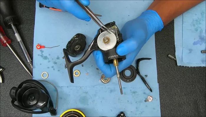 Use a nut on the pinion to help remove the gear assembly.