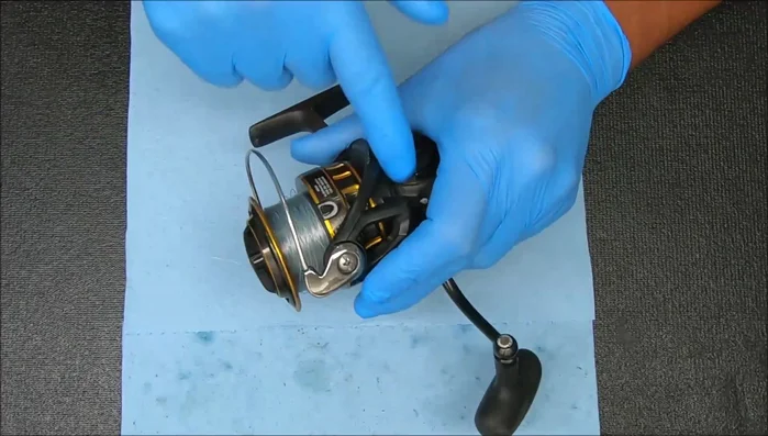 Remove the cap to inspect the internal components (bearings, anti-reverse clutch).