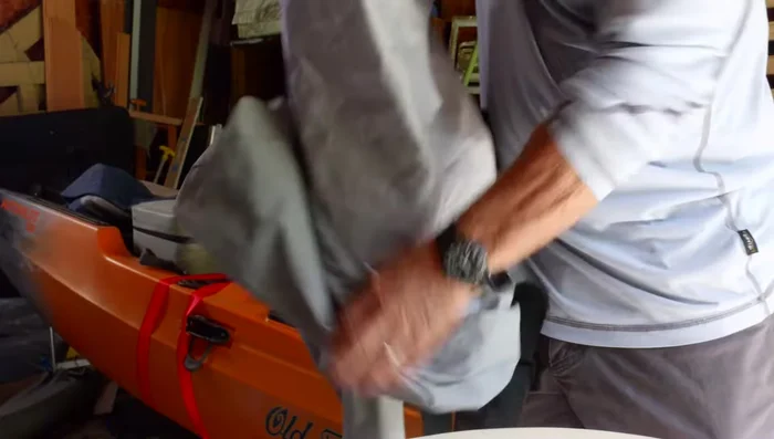 Coat the tear with Aquaseal, overlapping the edges.