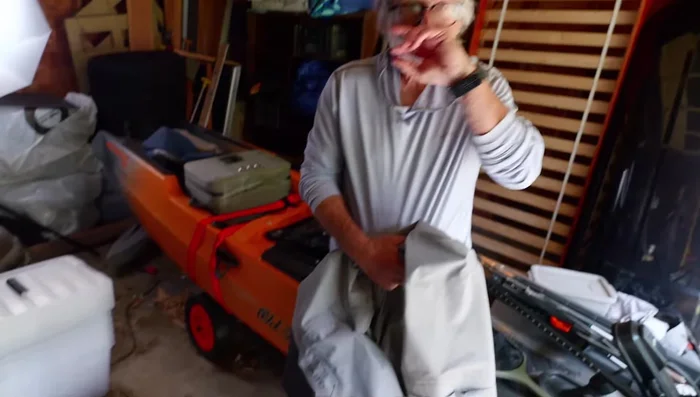 Reverse the hose of a shop vac so it blows air.