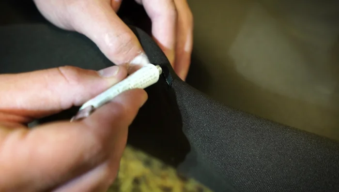 Apply a minimal amount of glue to both sides of the cut. Press the cut together and hold firmly for about a minute.