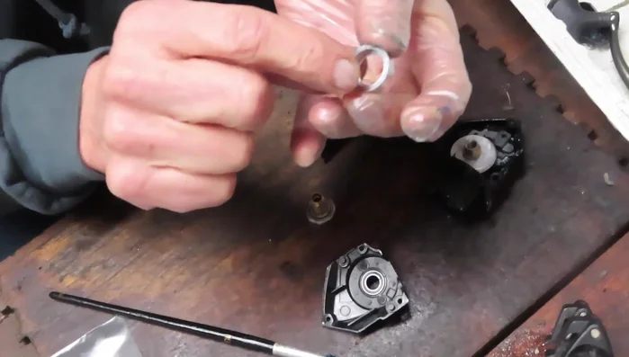 Install the second bearing (indentation down).