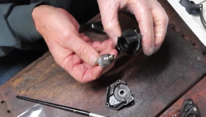 Install the tie-down screw.