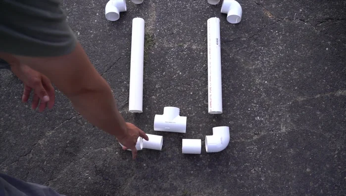 Cut the PVC pipes to the following lengths: three 3-inch pieces, two 18-inch pieces (base), two 2-foot pieces, one 9-inch piece (center support), two 3-foot pieces (top).