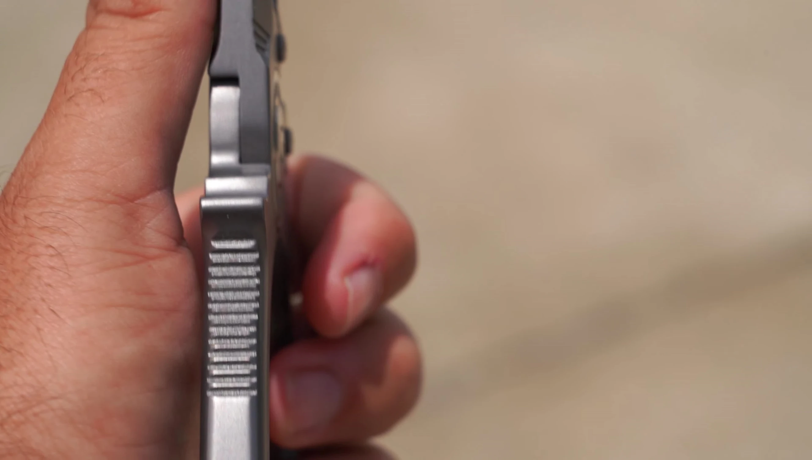 Detail of the non-slip grip texture on the pliers' handle.
