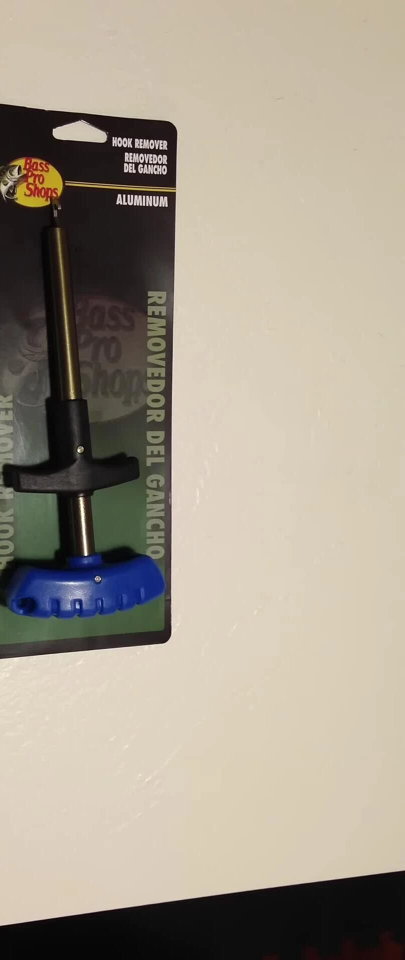 Initial shot of the reviewer holding the hook remover.