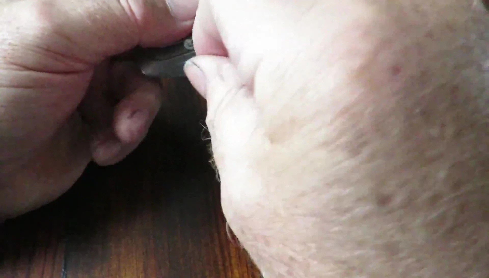 Demonstrating the process of feeding the line under the slot.