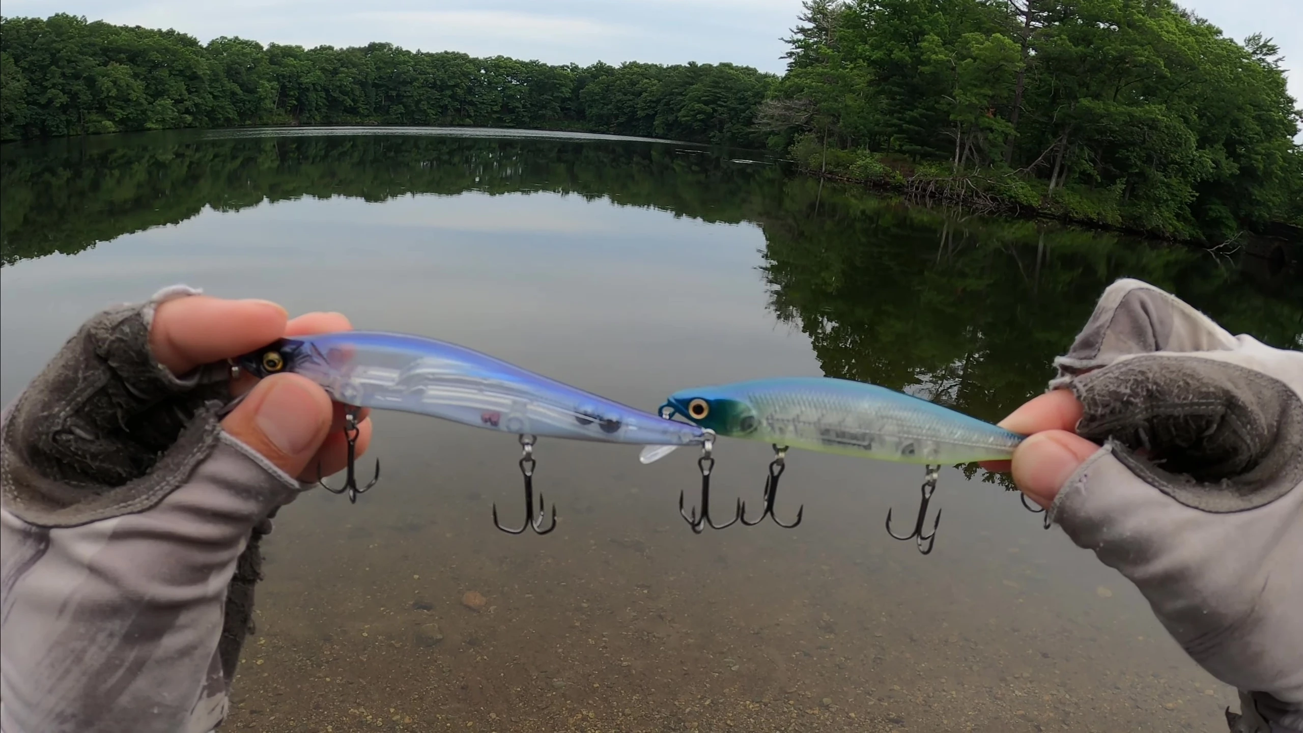 Detailed view of the hooks on both lures, highlighting the differences in curvature and barb orientation.