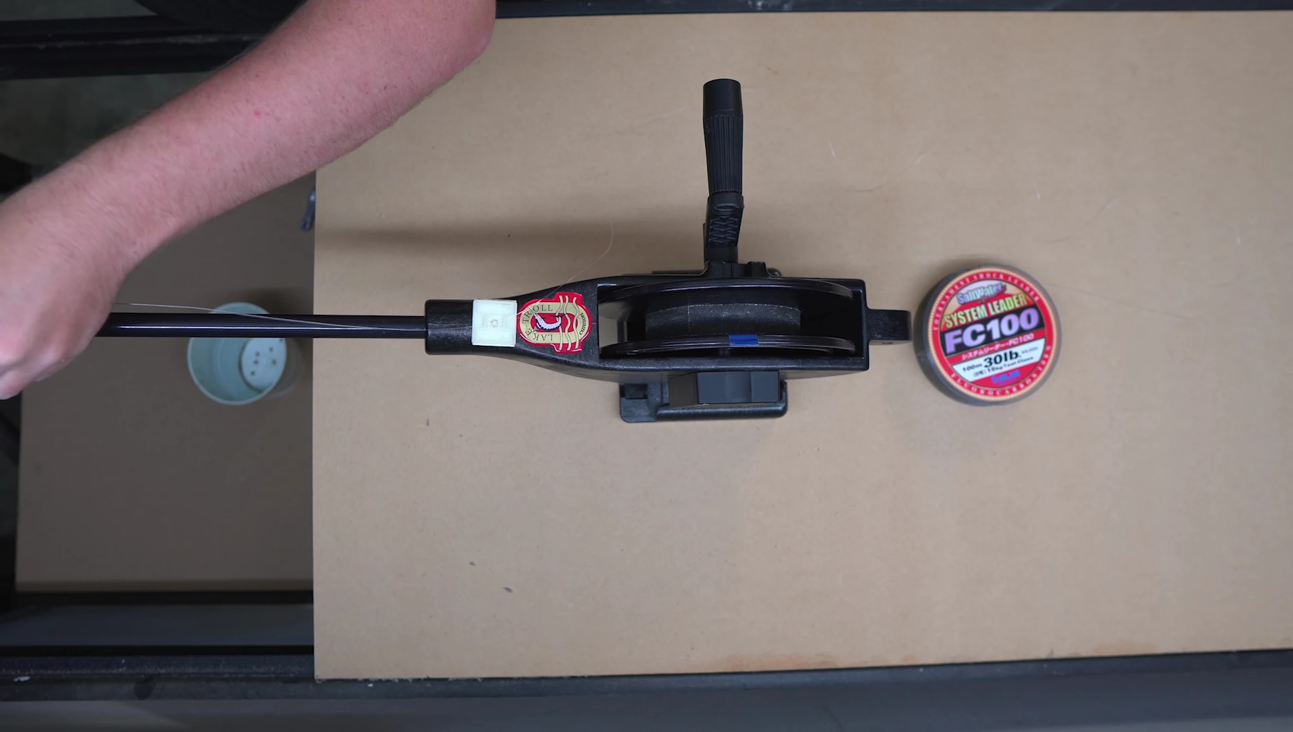The homemade abrasion testing machine in action with Sunline FC100