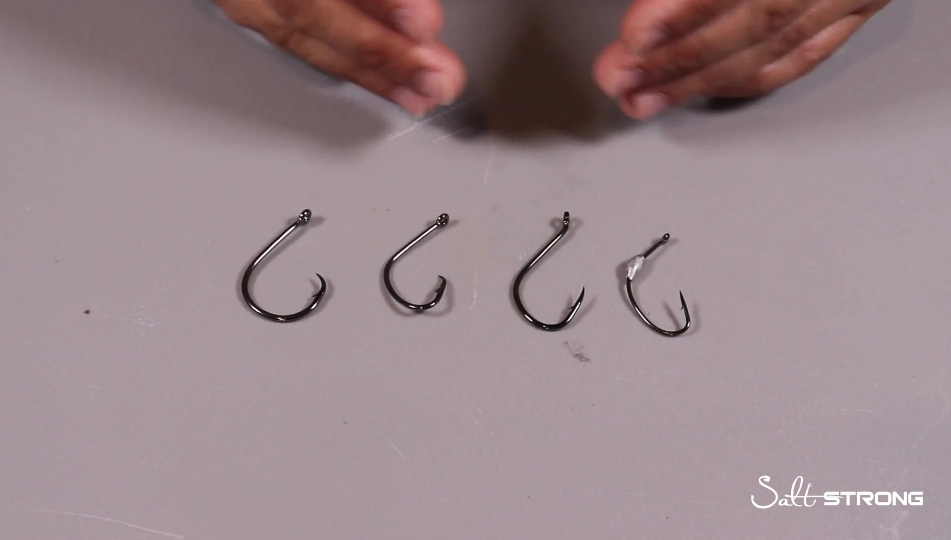 Speaker explaining the relationship between hook size and bait size