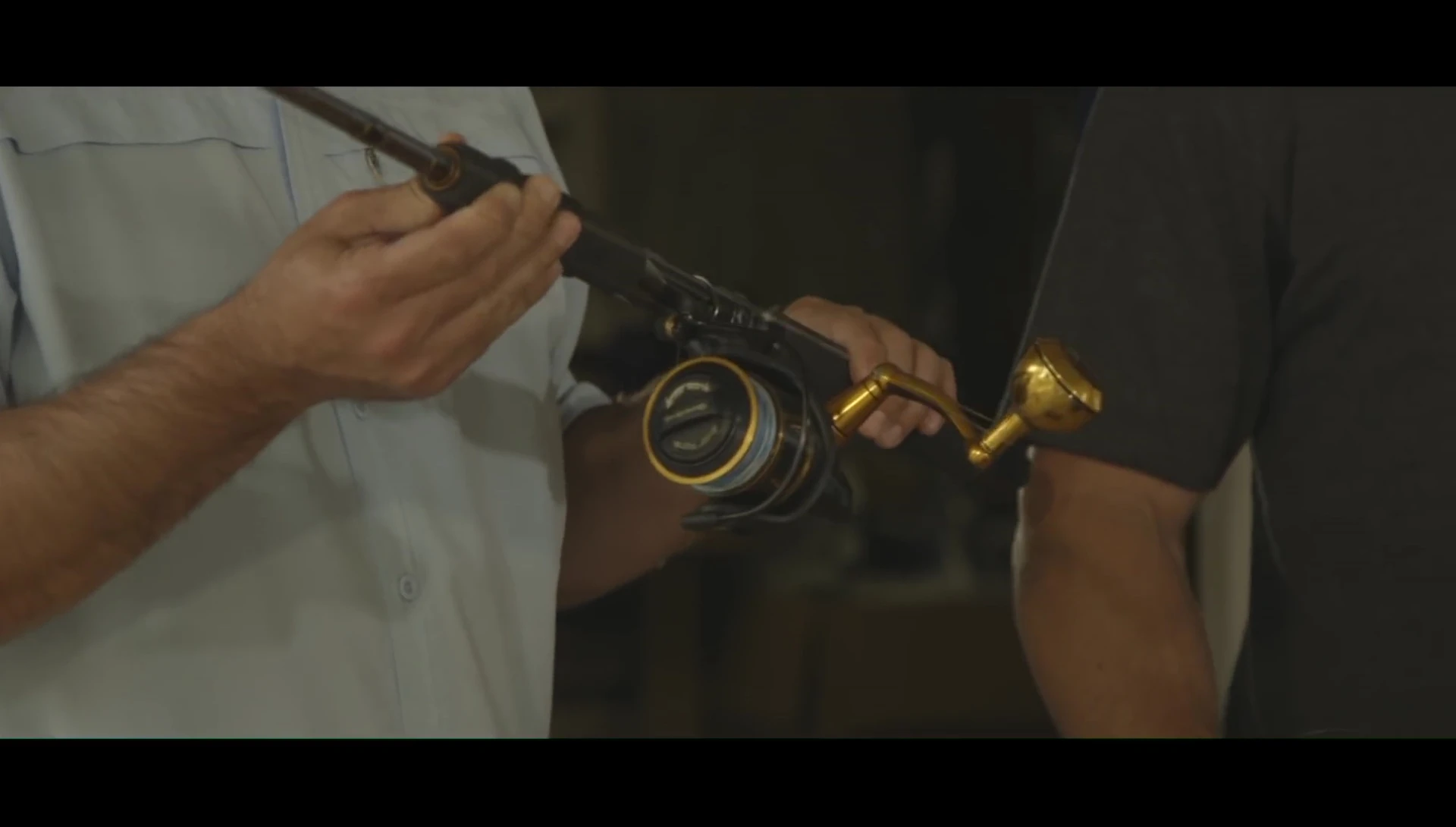 Angler showing the 15-pound test mono on the reel.