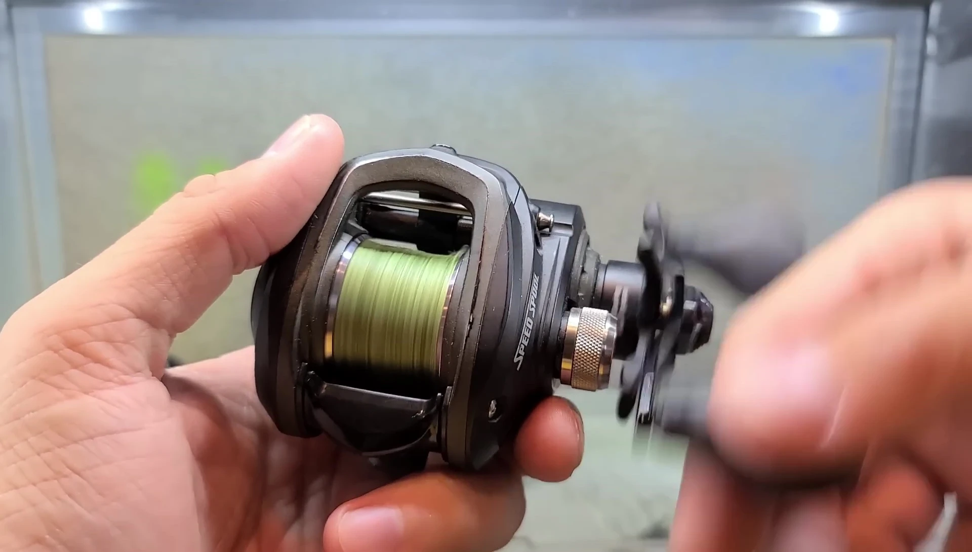 The reviewer demonstrating the smooth operation of the older reel