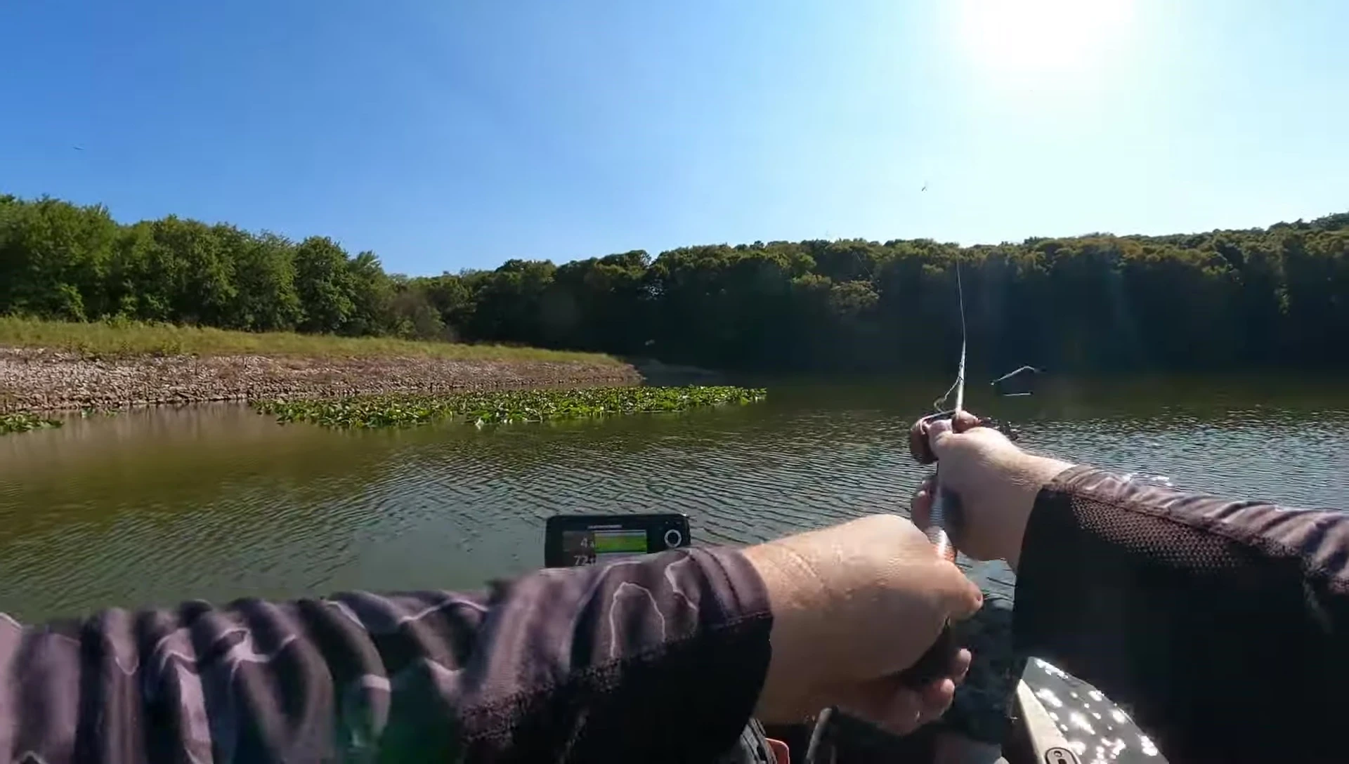 Angler casting with the spinning rod and retrieving a lure