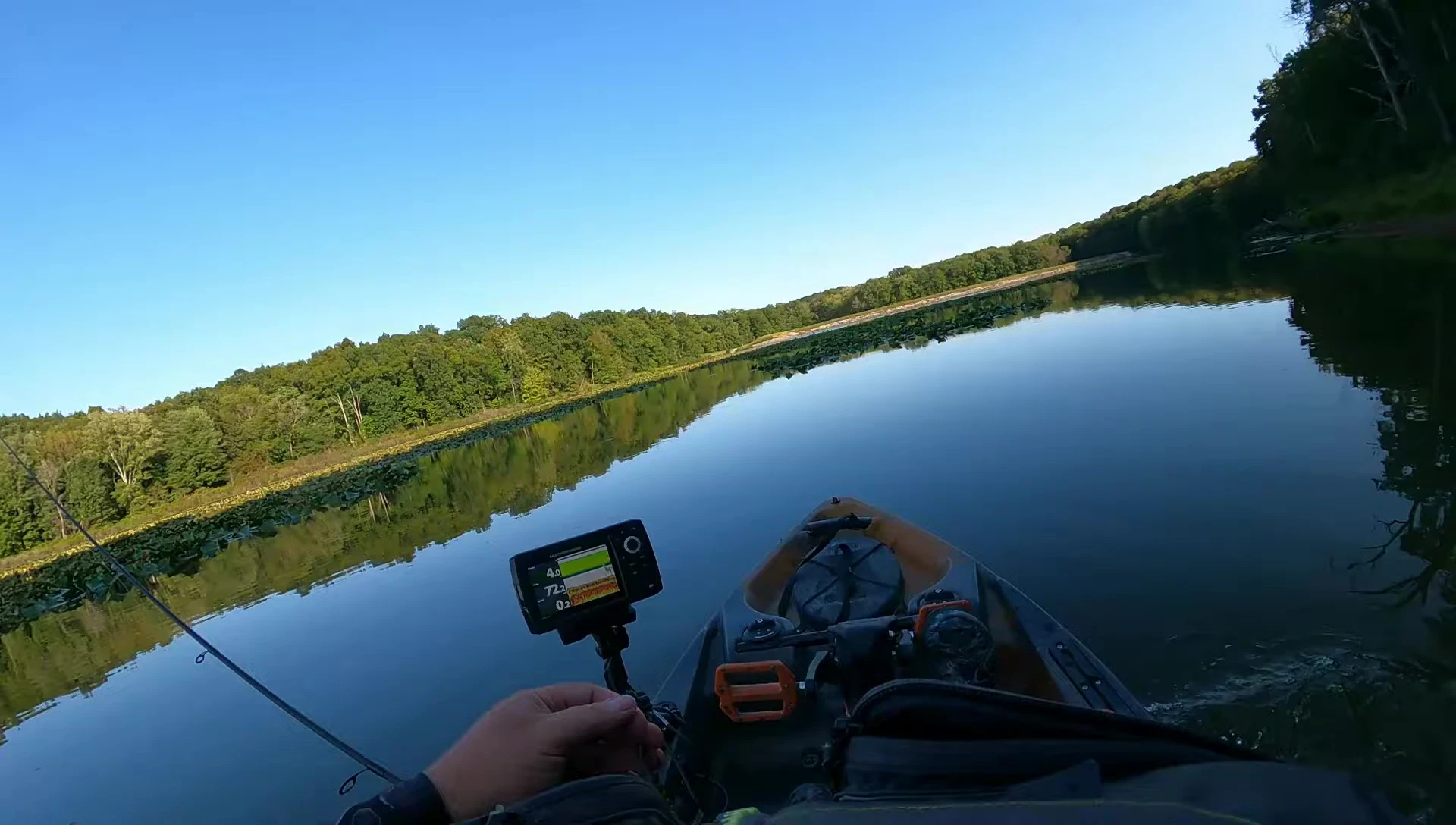 Angler holding the Lew's Mach Crush baitcasting rod