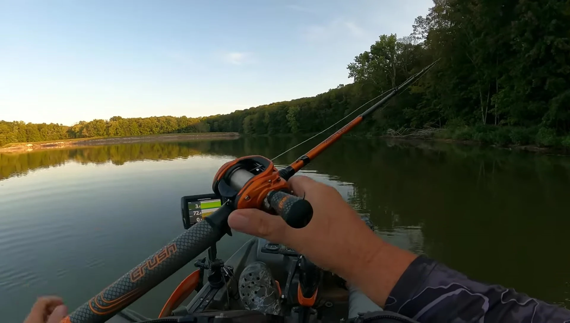 Close-up of the baitcasting reel during retrieval