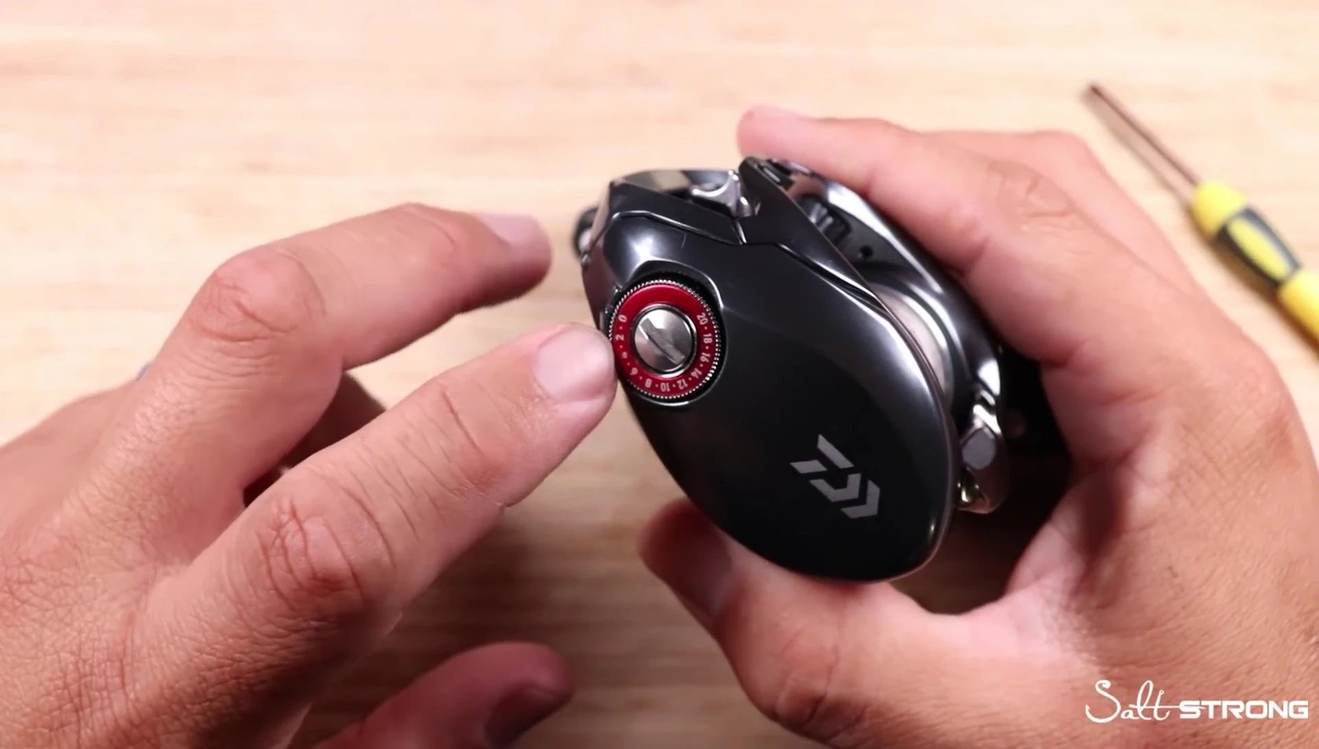 Discussion of the magnetic braking system's effect on casting distance.