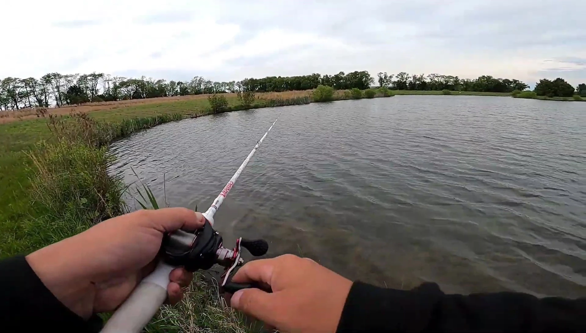 Fisherman fighting a fish
